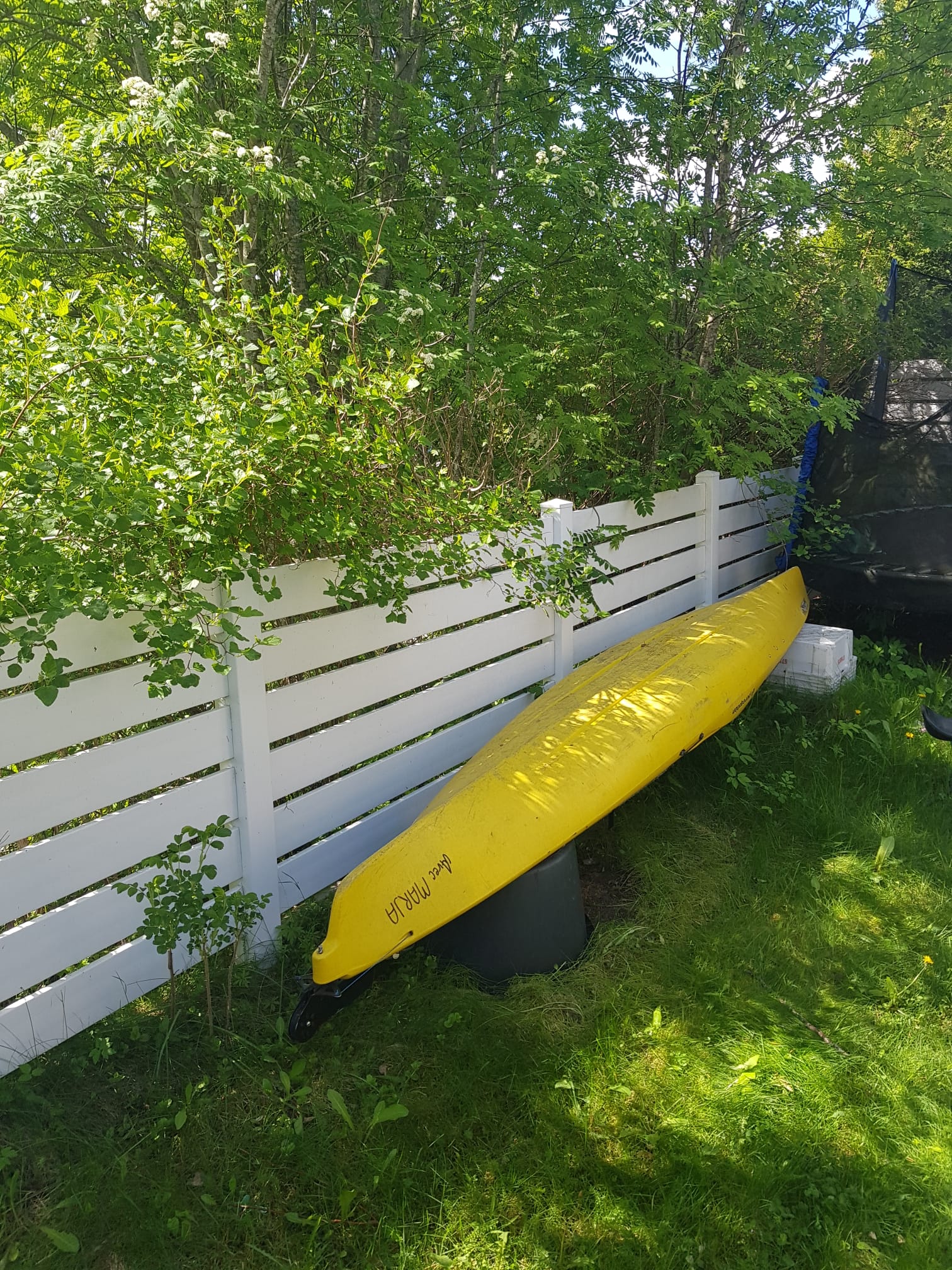 The kayak stored in the back yard between trips to the archipelago